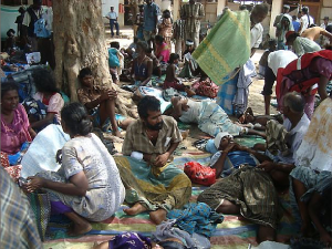 People at a makeshift hospital in Putumattalan that was treating survivors of attacks on April 8 and 9, 2009. Many were women and children who were waiting in a food distribution line in Pokkanai when artillery shells hit.