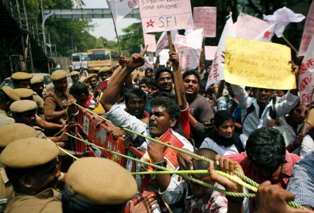 Indian Tamil activists and students shout slogans while trying to push past a barricade during a protest against Sri Lanka’s alleged wartime abuses, in Chennai, India, Tuesday, March 19, 2013. A key ethnic Tamil political party withdrew from the ruling Indian government Tuesday over its unmet demands that India amend the U.N. resolution to declare that Sri Lanka committed genocide against its minority Tamil population during the final months of its civil war against the Tamil Tiger rebels. Photo: Arun Sankar K.