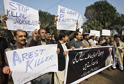 Pakistani journalists protest the killing of their colleague in January 2012. (AP/Mohammad Sajjad)