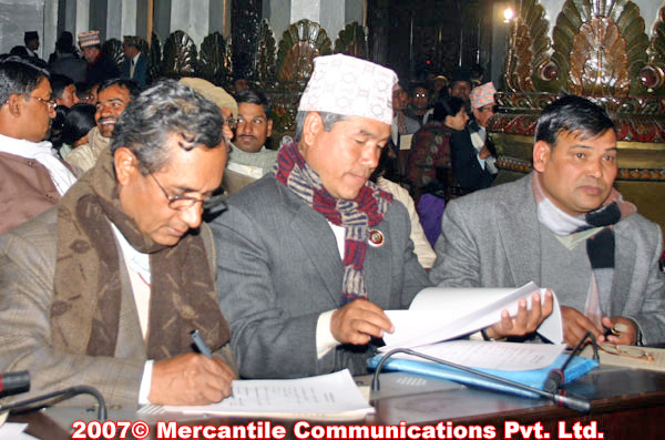 Maoist leaders and new members of parliament Dina Nath Sharma, Dev Gurung and Krishna Bahadur Mahara (from left to right) signing the oath of office and secrecy document at the Parliament building, Monday night, Jan 15 07. nepalnews.com/rh 