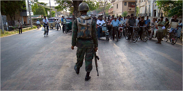  Sri Lankan solider blocked traffic last month on the main road in Jaffna to allow a military convoy to pass through the city at high speed June 15, 2007