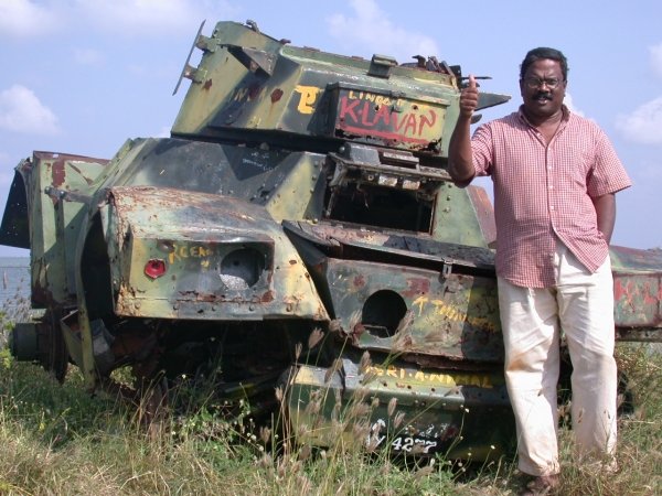 D Sivaram with destroyed Sri Lankan army armored vehicle, early 2000s