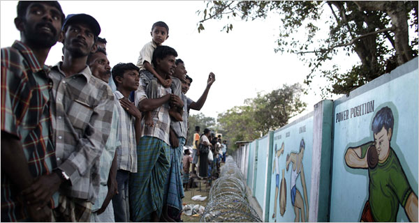 Tamil internment camp Vavuniya March 2009  Refugees speaking to relatives over fence