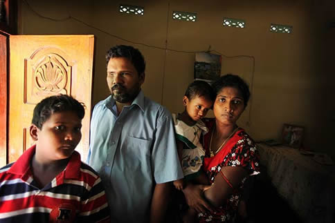 Kanthay Visavalingam (centre) with his family. They are displaced from their home in the Vanni and are staying with friends near Trincomalee. He was blinded by Sri Lankan army artillery shrapnel in the last days of fighing between the Army and the LTTE in the Vanni area Dec 2009