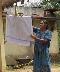 Aani Manuelpillai at her bombed-out home, which she has no money to repair.