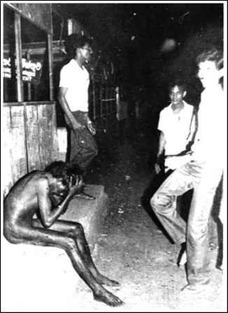 Naked Tamil before being burnt in Colombo July 1983 Black July tormenters dancing