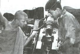 Buddhist monk inspecting tank Sri Lanka 1990s