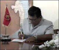 Velupillai Prabhakaran, as Liberation Tigers of Tamil Eelam leader, signs ceasefire agreement, AP Photo