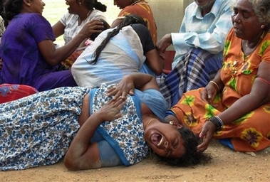 Muniyan Kajawarnam after identifying the body of her nephew, Trincomalee, Dec. 5, 2006