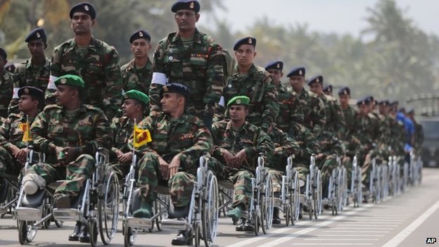 Sri Lankan war amputee soldiers participate in a Victory Day parade in Matara, 18 May 2014