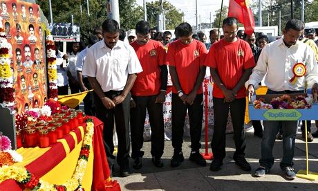 Tamils pay tribute to Tamil victims during a rally in Geneva