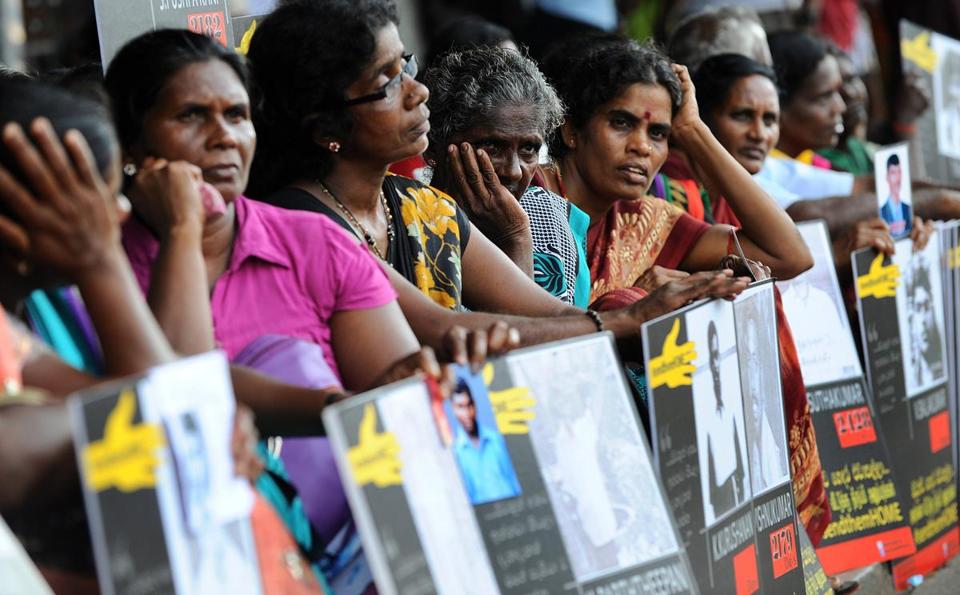 During a demonstration in Sri Lanka, relatives of Tamil activists held placards demanding the release of their loved ones who have been held in detention without trial for long periods of time.