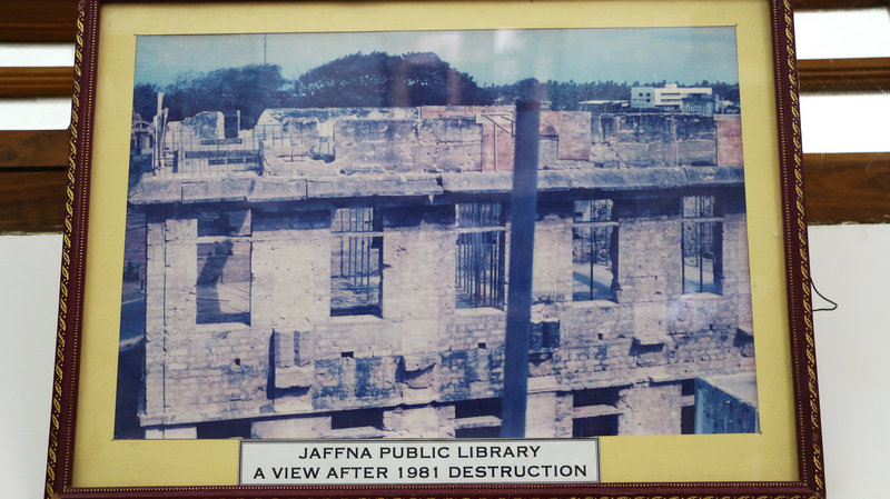 This framed picture depicts the library in 1981, after it was destroyed in a fire that Sri Lankan Tamils suspect was set by government police.